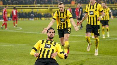 Borussia Dortmund 2-1 RB Leipzig: Marco Reus and Emre Can goals fire BVB to top of Bundesliga table