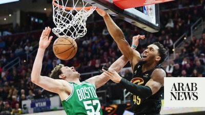 Cavs hand Celtics third straight defeat in overtime, Sixers roll on