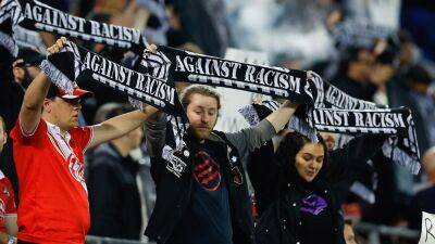 New York Red Bulls supporters walk out in protest over handling of player's racist language