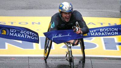 Switzerland man Marcel Hug, American woman Susannah Scaroni take Boston Marathon wheelchair titles