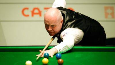 Heavy-scoring John Higgins through to World Snooker Championship second round after convincing win over David Grace