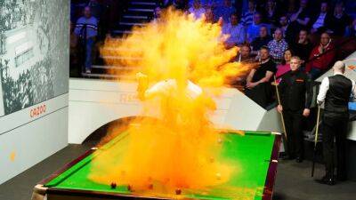 Snooker table vandalized by climate activist during world championship now reclothed, back in play in England
