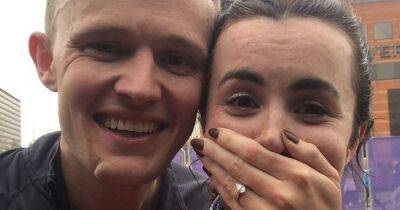 "We can't believe it": Elated couple filmed getting engaged at Manchester Marathon finish line react to viral clips