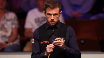 World Championship: Jack Lisowski in round two after tense win over Noppon Saengkham; Judd Trump or Anthony McGill next