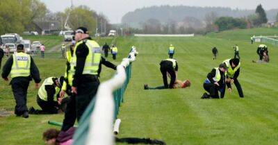 Number of arrests made after protesters try to stop Scottish Grand National