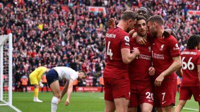 Liverpool overcome blown three-goal lead, top Spurs in stoppage