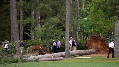 Trees down and golf halted as poor weather hits Augusta