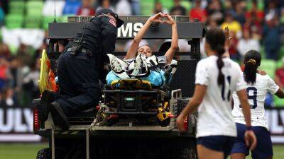 USA's Mallory Swanson taken to hospital with knee injury