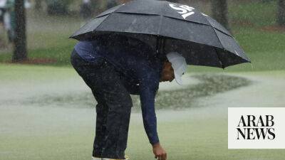 Koepka extends Masters lead to four shots before rain stops play