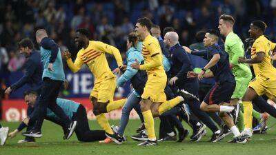 Barcelona players chased off pitch by Espanyol fans after celebrating Liga title win on away soil
