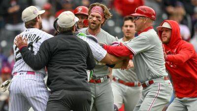 Philadelphia Phillies - Tommy John - Bryce Harper - Kyle Schwarber - Rob Thomson - Phillies' Bryce Harper ejected after charging at Rockies' dugout - ESPN - espn.com - state Colorado