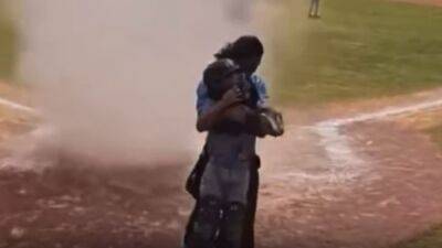Umpire pulls child out of dust devil during youth baseball game: 'You saved his life'