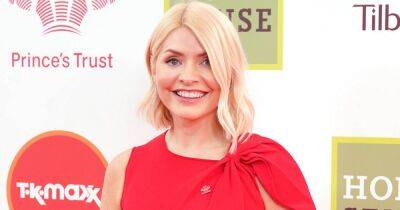 Holly Willoughby 'lady in red' as she brushes off This Morning drama with beaming appearance