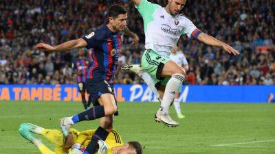 Alba pulls Barca closer to title with late Osasuna strike
