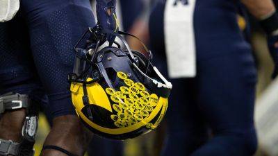Son of longtime Michigan coach apologizes over controversial Twitter 'likes'