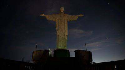 Lights go out at Rio's Christ the Redeemer in support of Vinicius