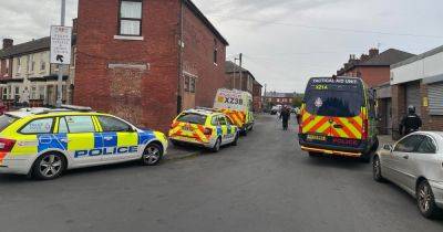 Huge police presence in Gorton as homes raided with drugs, wads of cash and stolen vehicles seized