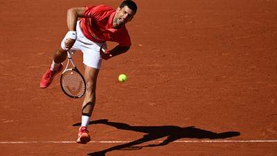 Djokovic eyes French Open history as Swiatek launches title defence