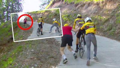 Giro d'Italia: 'Mind-blowing' backstory of mystery fan who ran to help Primoz Roglic