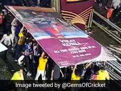 Virat Kohli - Gujarat Titans - Virat Kohli To The Rescue! Giant Poster Saves Fans In IPL 2023 Final From Rain In Ahmedabad - sports.ndtv.com - India -  Ahmedabad -  Chennai
