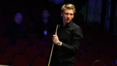 Iulian Boiko wins thriller to keep hopes alive at snooker Q School with comeback victory over Stuart Carrington