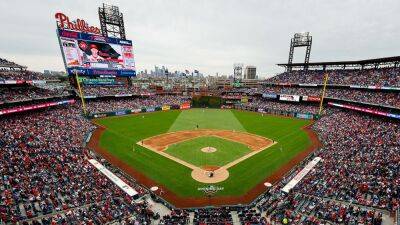 Phillies fan carted off field after falling into bullpen