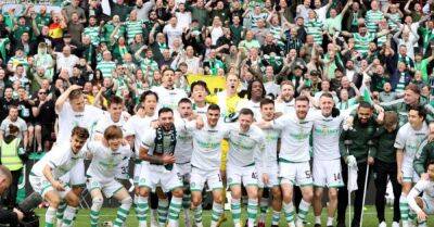 Celtic wrap up league title with victory at 10-man Hearts