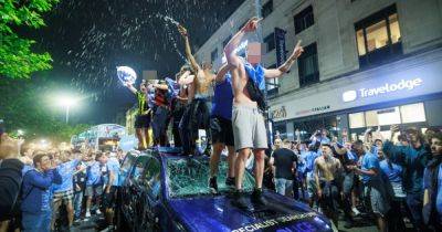 Arrests made as police van smashed amid Man City celebrations in Manchester city centre