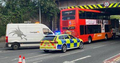 Live updates as double decker bus gets stuck under bridge in Cardiff