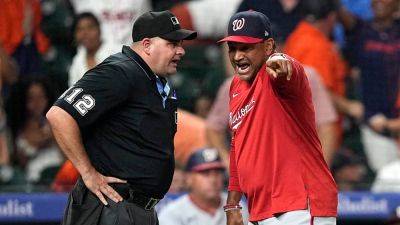 Nationals manager brings photo evidence to press conference after controversial call costs team game