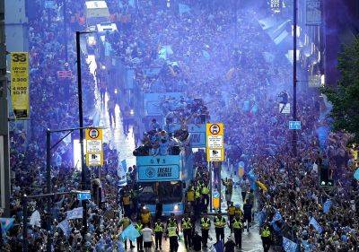 Thousands line streets for Man City victory parade