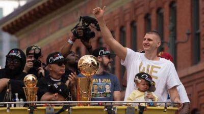 Nikola Jokic - Michael Malone - Nuggets celebrate first NBA title with parade through Denver - ESPN - espn.com -  San Antonio