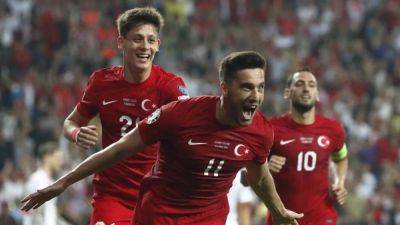 Danny Ward - Chris Mepham - Hakan Calhanoglu - Turkey go top after beating 10-man Wales - channelnewsasia.com - Turkey - Armenia