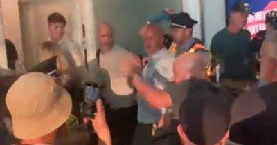 Moment angry Roma fans ambush Manchester referee Anthony Taylor and his family at airport