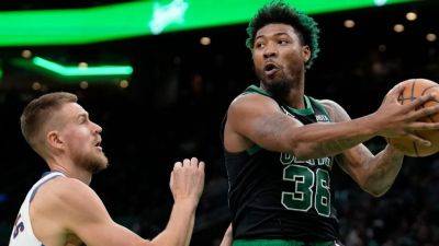 Grizzlies acquire Marcus Smart from Celtics in 3-team deal involving Kristaps Porzingis and Tyus Jones, sources say - ESPN