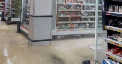 Torrential rain causes massive leak at supermarket