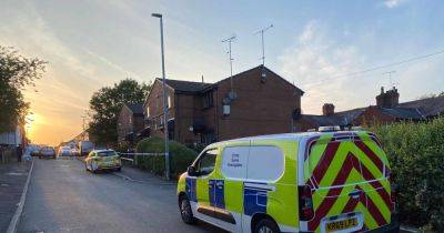House taped off as two men taken to hospital after attack 'with weapons'