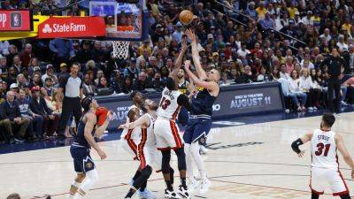 Miami Heat edge out Denver Nuggets to level NBA Finals