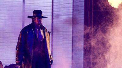 Shawn Michaels - The Undertaker leers at shark after it approaches wife at beach - foxnews.com - Britain