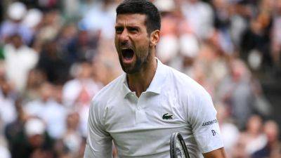 Novak Djokovic rallies to equal Federer's semi-final mark with latest Wimbledon win