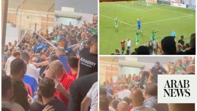 Israeli club Maccabi Haifa’s UEFA Champions League qualifier stopped amid fan violence, pro-Palestinian chanting
