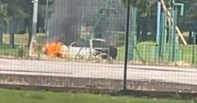 BREAKING: 'Fireworks launched at police station' and car set alight after day of chaos and disorder in Salford