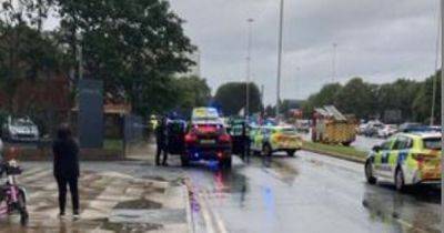 Man rushed to hospital after being knocked down by police car
