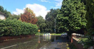 Lightning, flooding, a SINKHOLE... storms hit Greater Manchester again