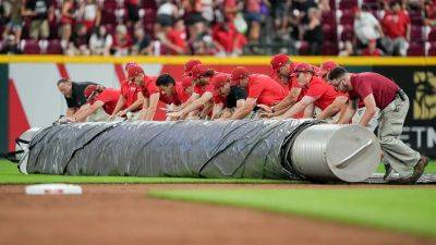 Reds grounds crew member gets gobbled up by 'tarp monster' during weather delay
