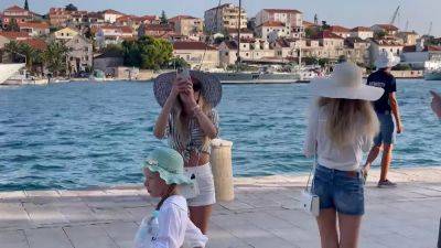 Croatia celebrates bumper summer season after joining the euro. But locals aren't so happy