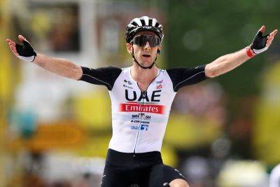 UAE Team Emirates rider Adam Yates wins opening stage of Tour de France