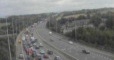 LIVE: Two rushed to hospital after tanker overturns, with 'large quantity' of milk on motorway - latest updates