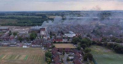 Boy, 14, arrested on suspicion of arson after huge blaze tears through building - manchestereveningnews.co.uk