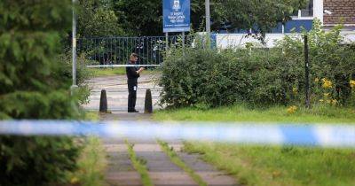 Man's body found as wooded area near school taped off by police